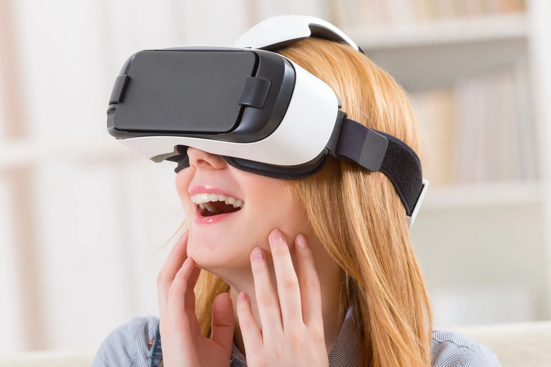 A guest immersed in a VR photo booth experience wearing a headset and controllers