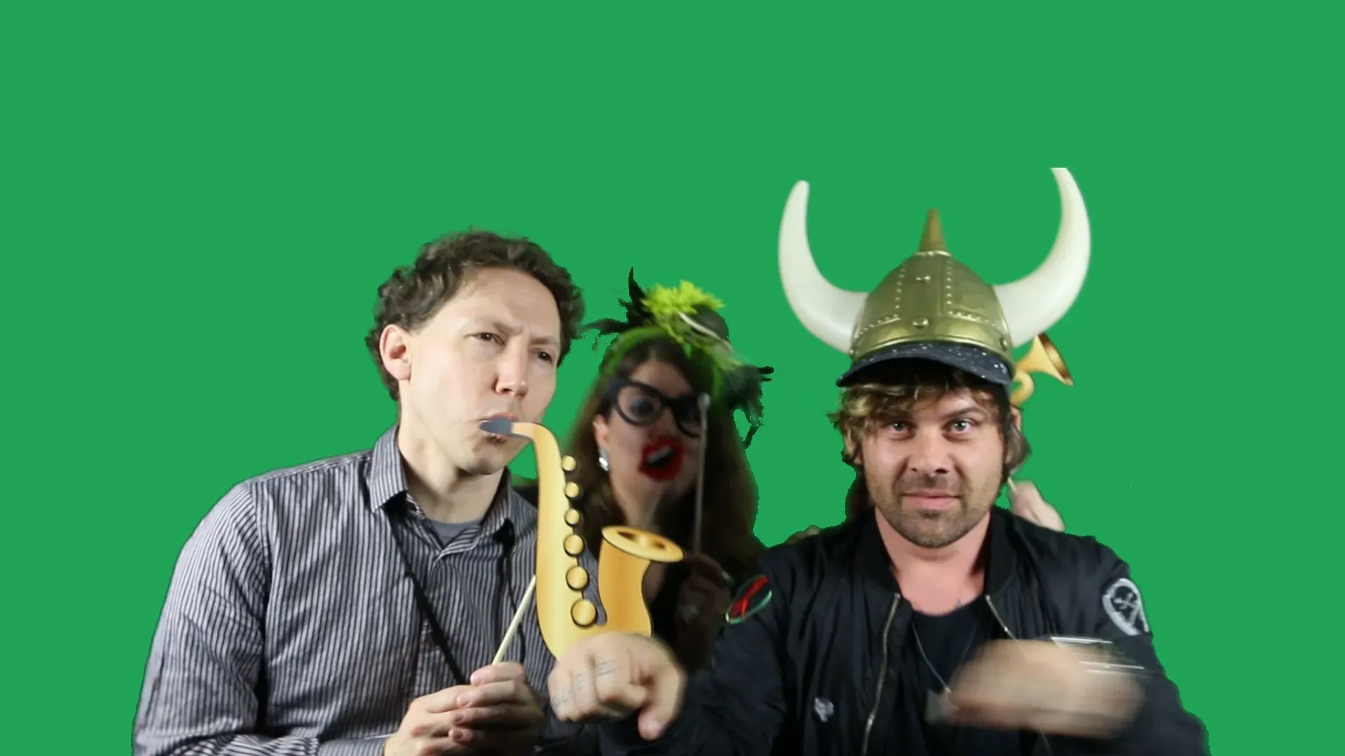 Guests in front of a plain green screen before compositing